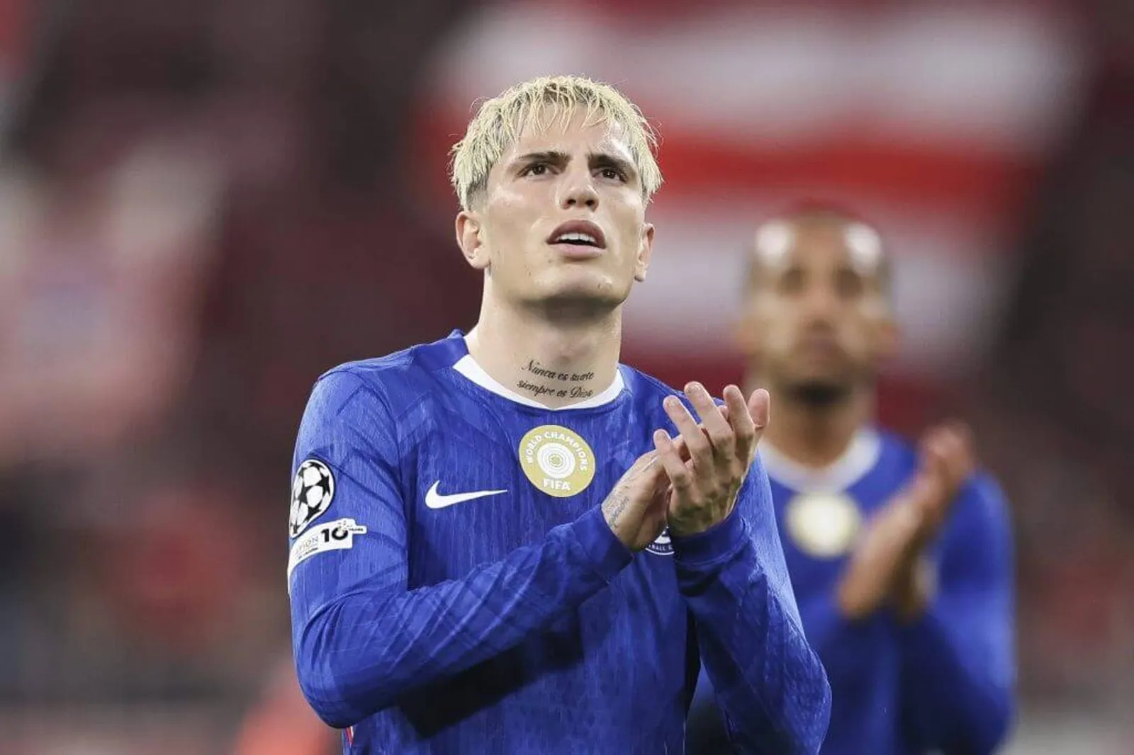 Alejandro Garnacho applauds fans after a game